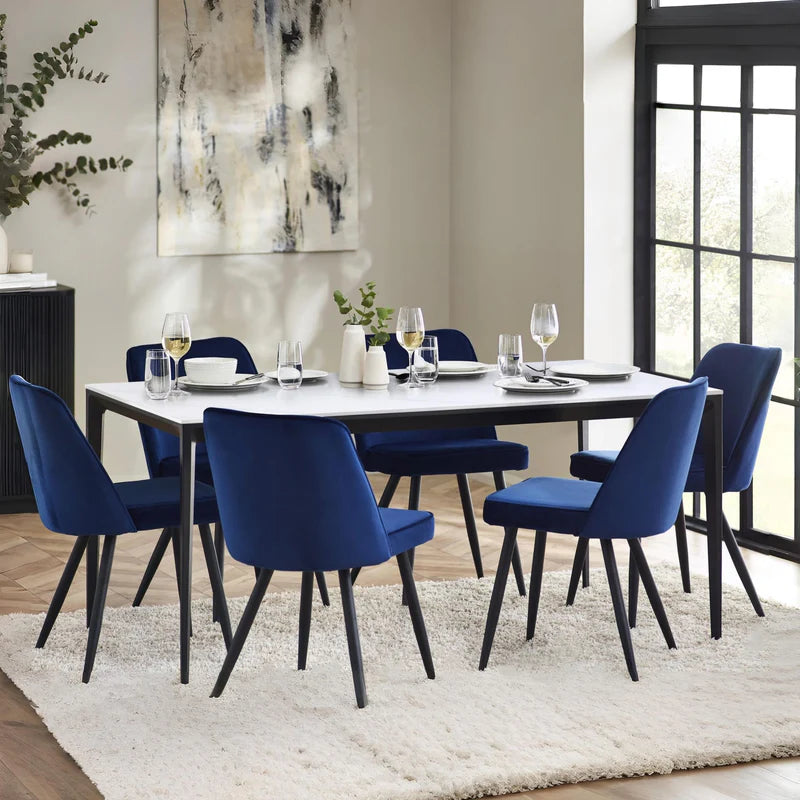 Rectangular table with white top and black legs on a white background