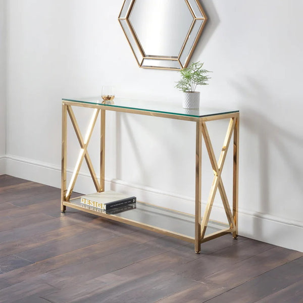 Gold console table with glass top in a room setting