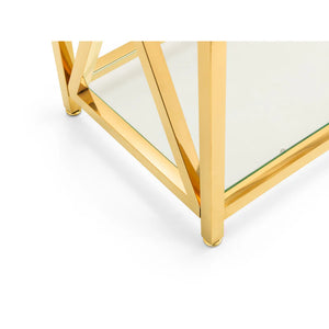 Gold geometric coffee table with glass top on a white background