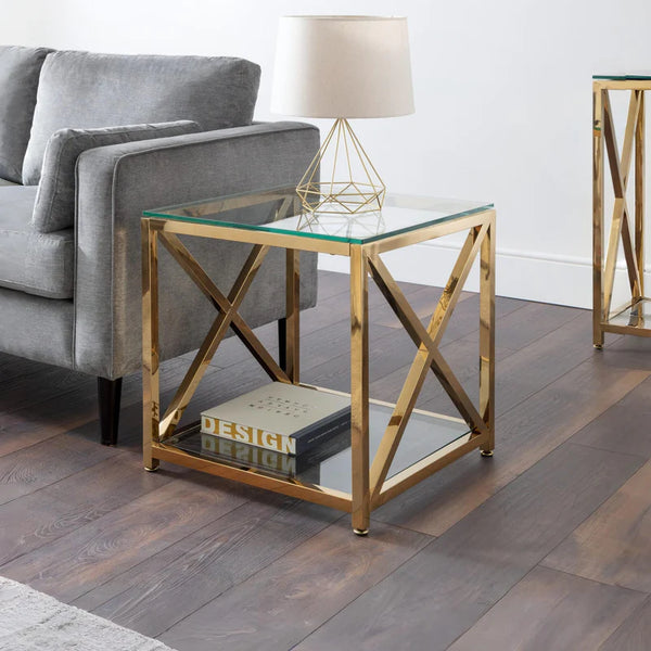 Gold side table with glass top in a living room setting