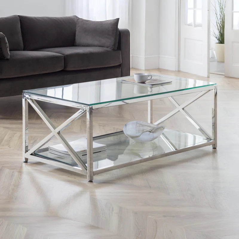 Glass coffee table with metal frame on a white background