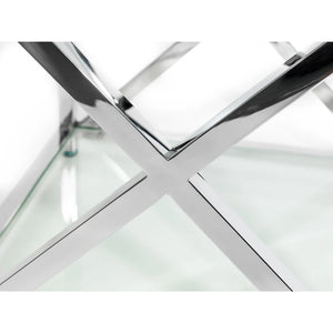Glass table with chrome metal frame on a white background