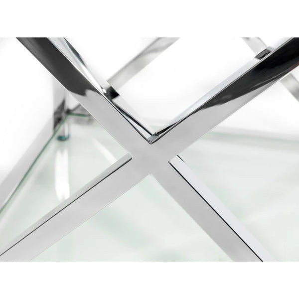 Glass table with chrome metal frame on a white background