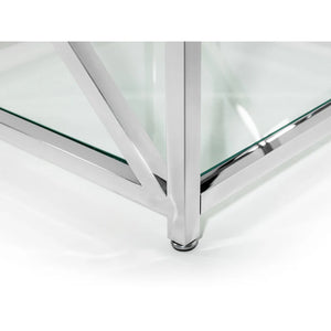 Glass table with chrome legs on a white background