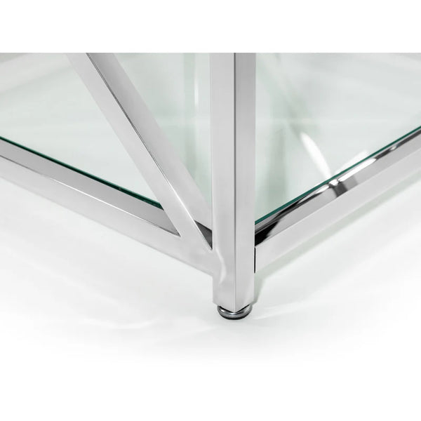 Glass table with chrome legs on a white background
