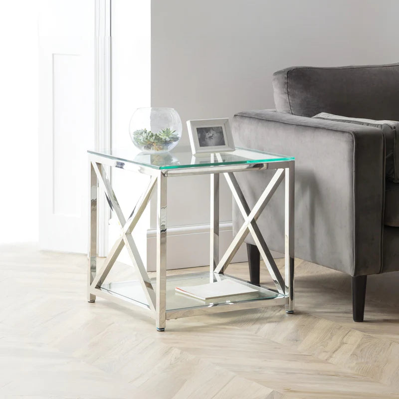 Glass side table with metal frame on a white background