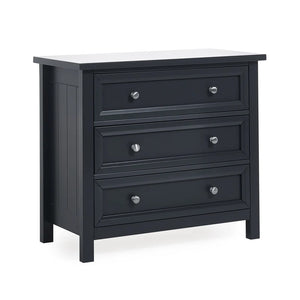 Black dresser with white top on a white background