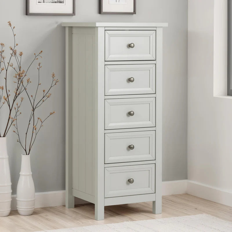 grey dresser with four drawers on a white background