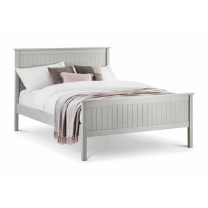 Gray wooden bed with white bedding and decorative pillows on a white background