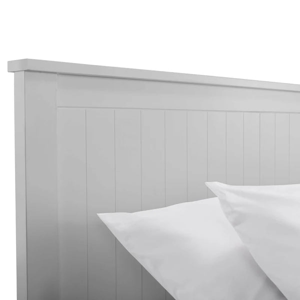 Gray wooden headboard with white pillows on a white background