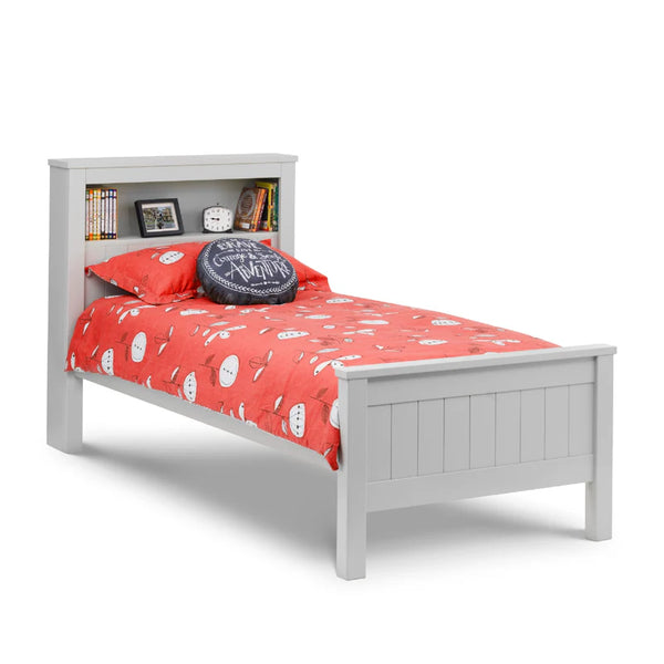 Grey bed frame with red bedding and decorative items on a white background