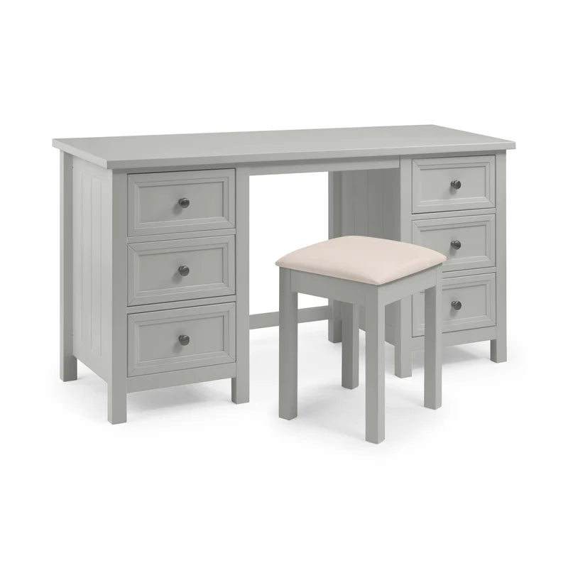 Gray desk with multiple drawers and a matching stool with a beige cushion on a white background
