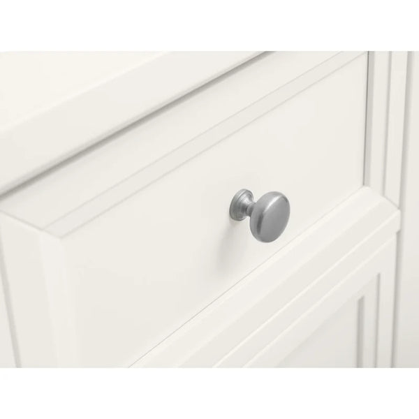 Close-up of a white cabinet with a silver knob on a white background
