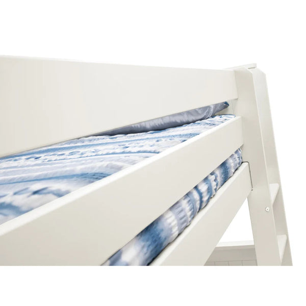 White bed frame with a blue and white patterned bedspread on a white background