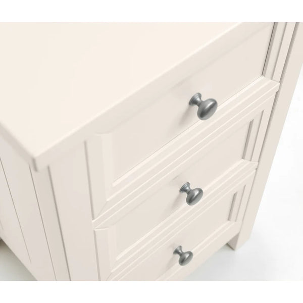 Close-up of a white cabinet with silver handles on a white background
