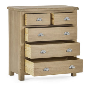 Wooden dresser with five drawers on a white background
