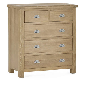 Wooden dresser with six drawers and metallic handles on a white background