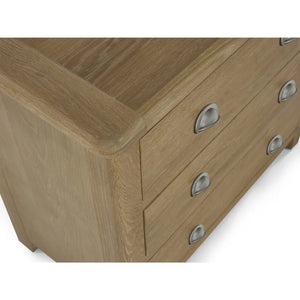 Wooden dresser with silver handles on a white background