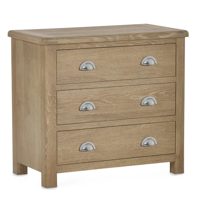 Wooden dresser with three drawers and metallic handles on a white background