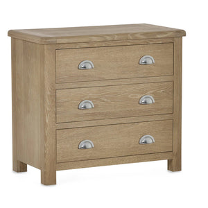Wooden dresser with three drawers and metallic handles on a white background