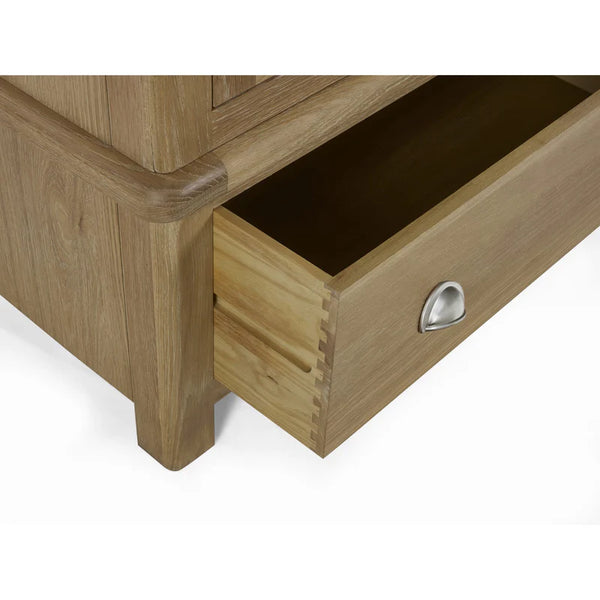 Wooden drawer with a metal handle on a white background