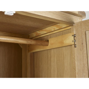 Wooden cabinet with open door showing hinge mechanism