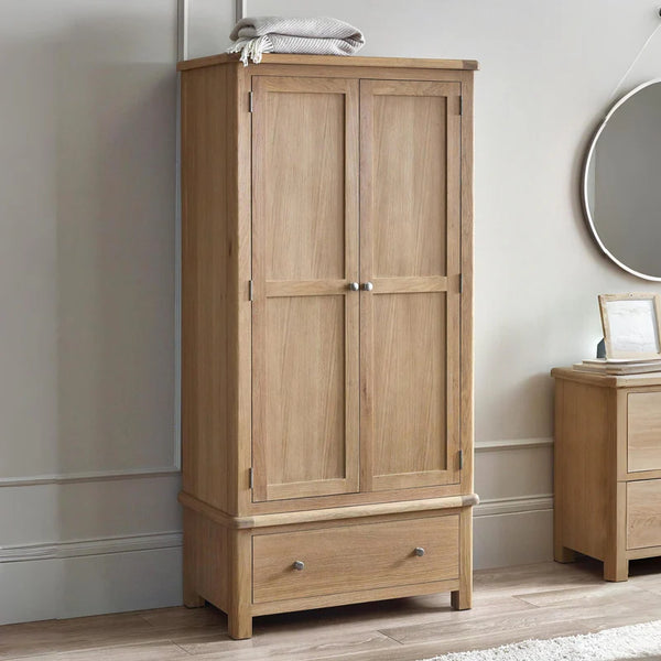 Wooden wardrobe with a mirror and nightstand in a room setting
