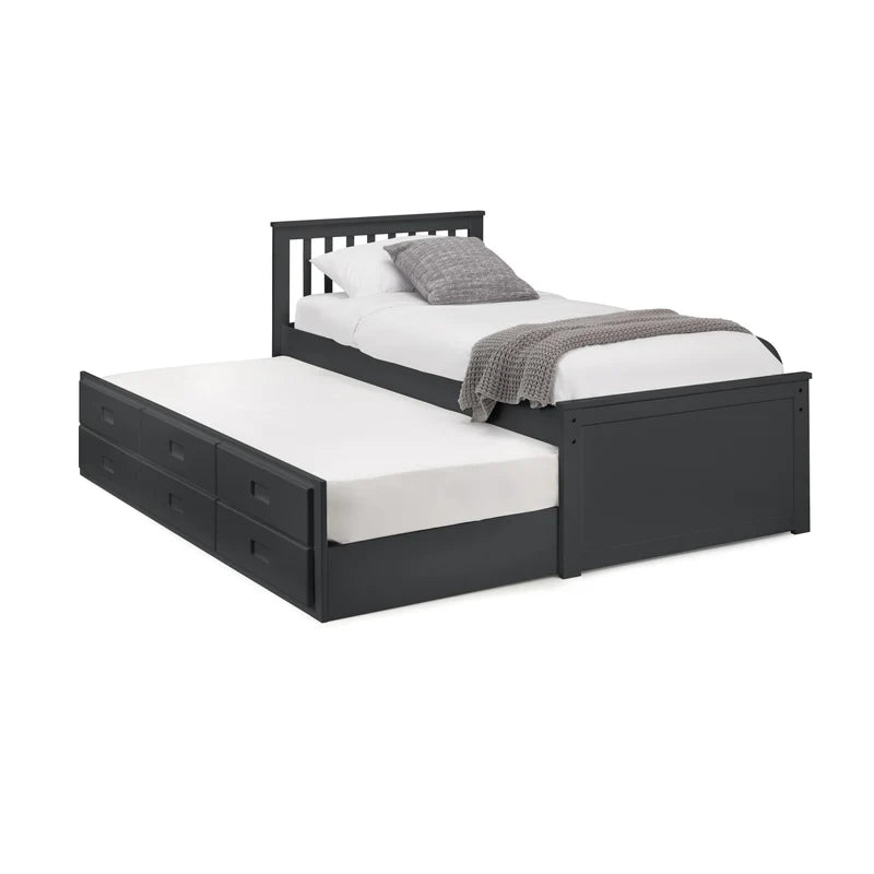 Black bed frame with pull-out trundle and white bedding on a white background