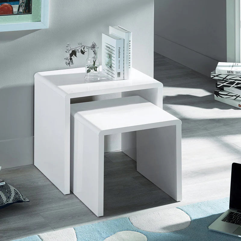 Two white nesting tables on a white background