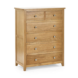 Wooden dresser with multiple drawers on a white background