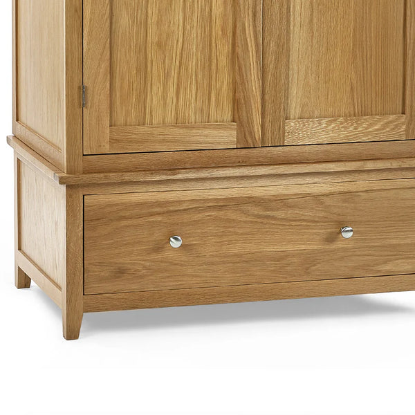 Wooden wardrobe with two doors and two drawers on a white background