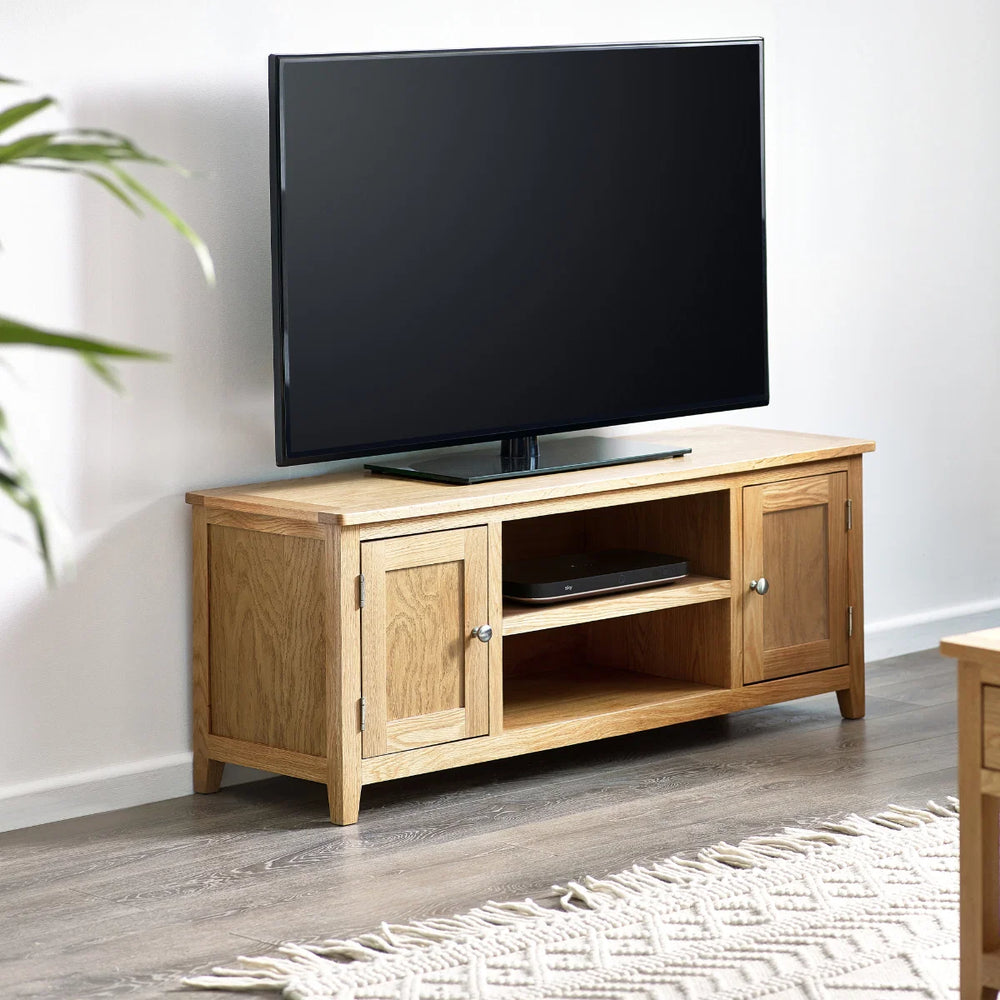 Oak TV unit with two doors on a white background