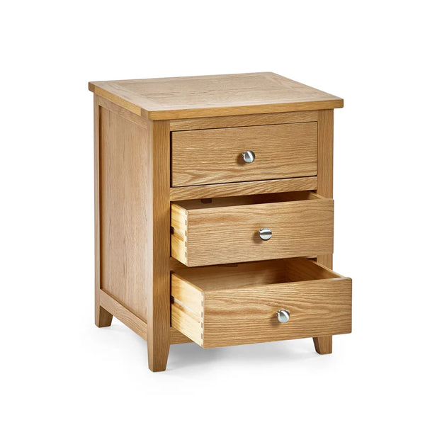 Wooden nightstand with three drawers on a white background
