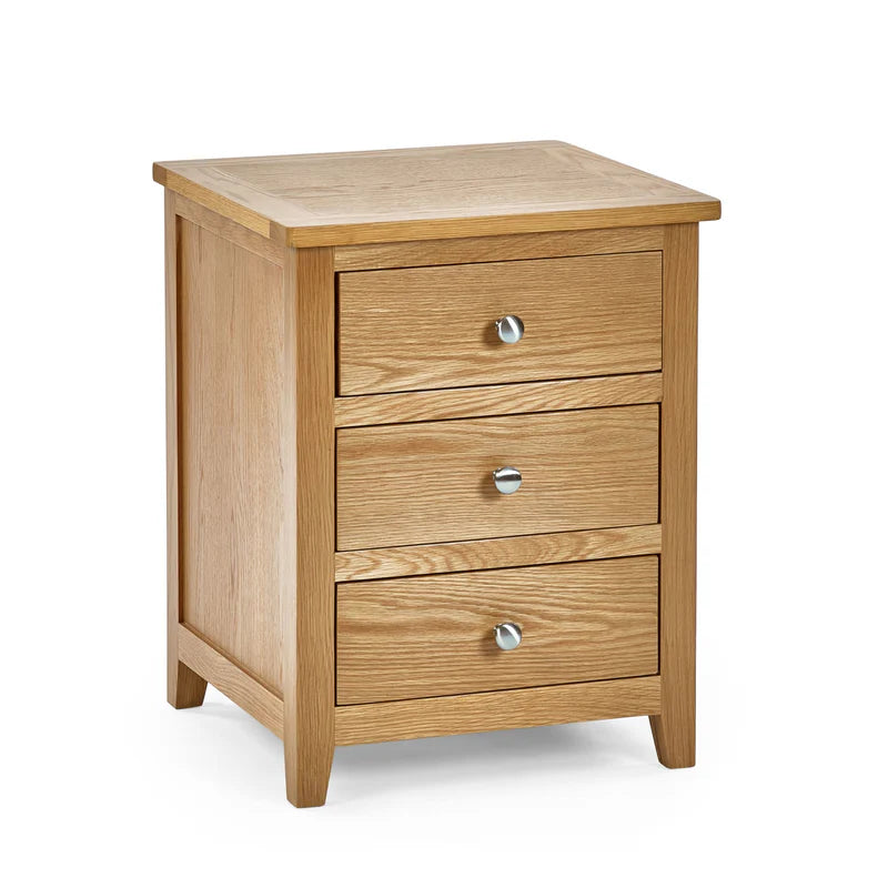 Wooden nightstand with three drawers on a white background