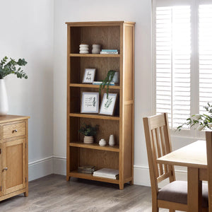 oak bookcase n a roomshot with accessories n the shelves