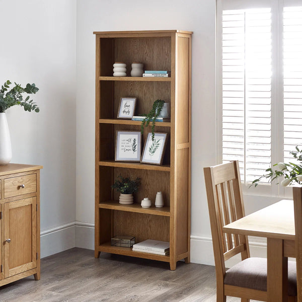 oak bookcase n a roomshot with accessories n the shelves