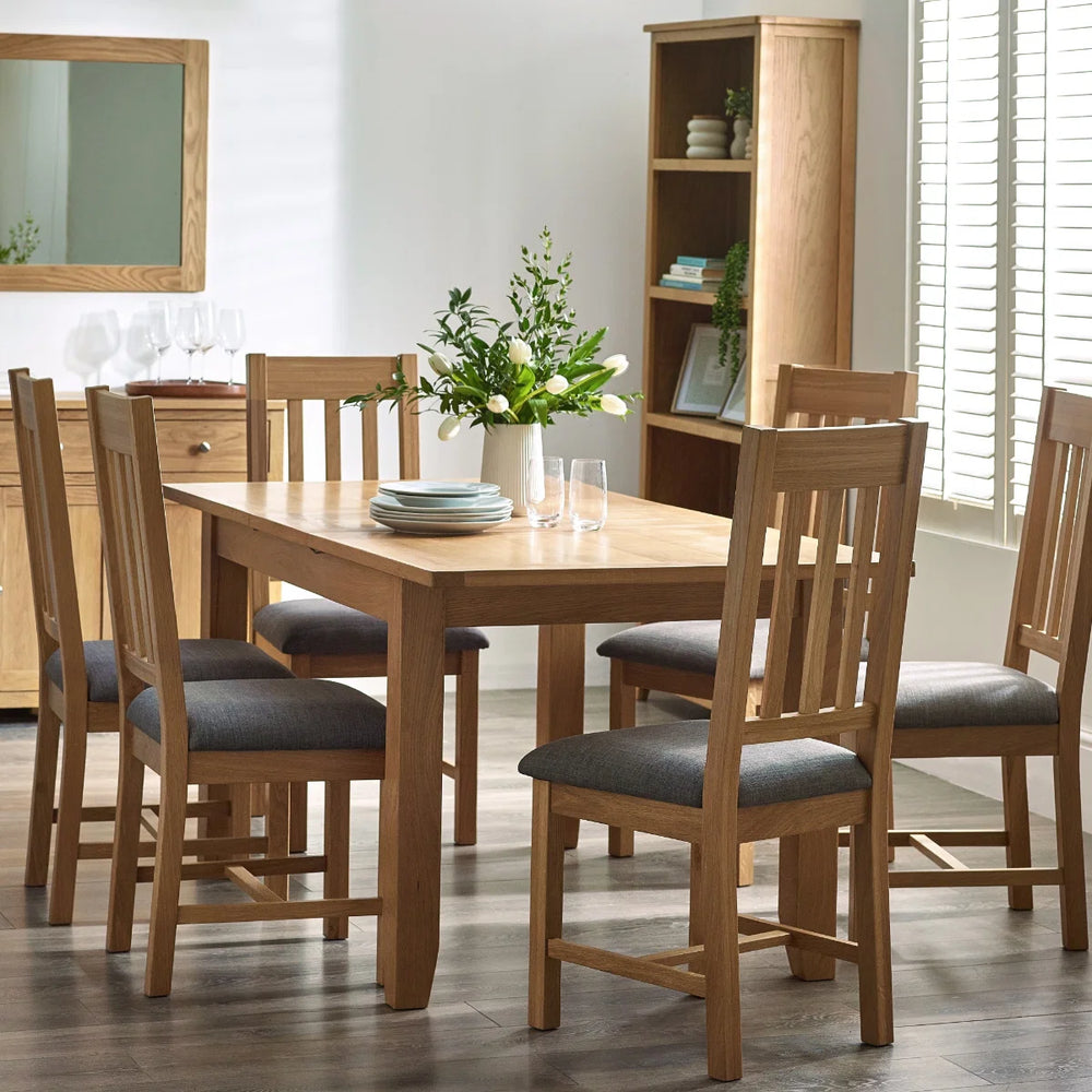 Wooden dining table on a white background