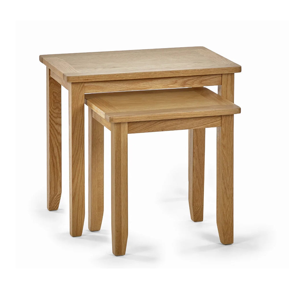 Two wooden nesting tables on a white background