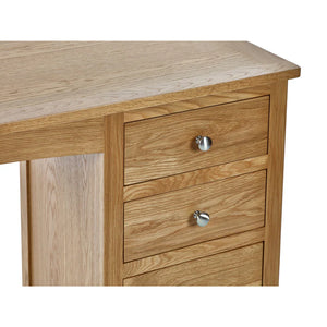 dressing table oak top detail with silver knobs on a white background