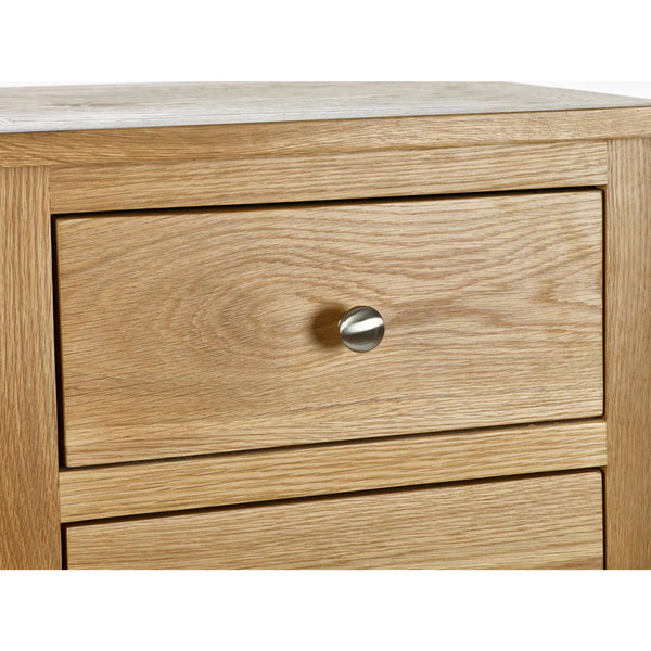 Wooden drawer with a silver handle on a white background