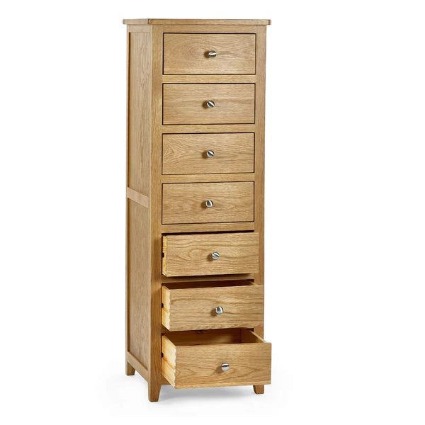 Wooden dresser with seven drawers on a white background