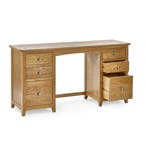 Wooden desk with multiple drawers on a white background