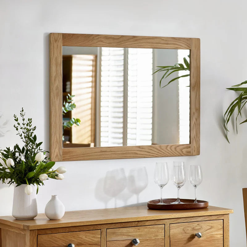 Wooden frame mirror on a white background