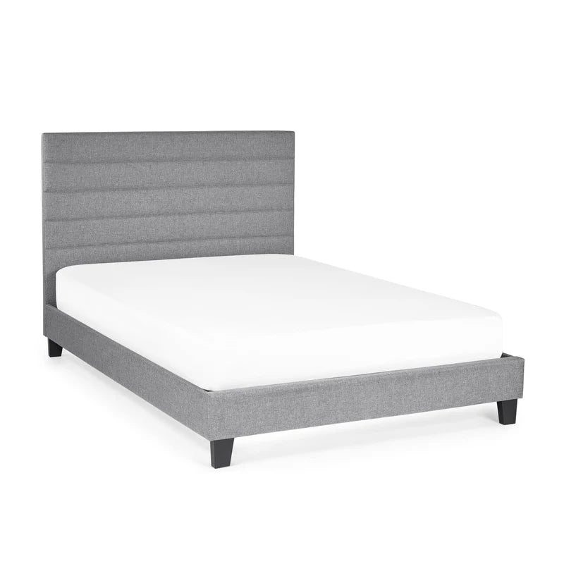 Gray upholstered bed frame with white mattress on a white background