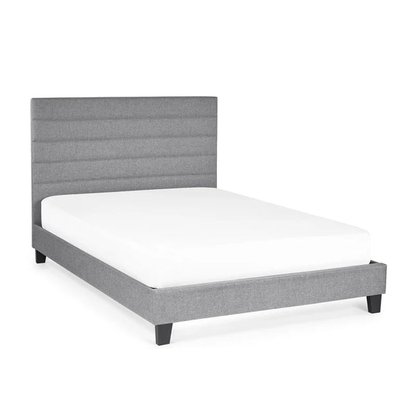 Gray upholstered bed frame with white mattress on a white background