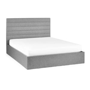 Gray upholstered bed frame with white mattress on a white background