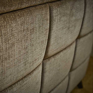 Close-up of a textured beige fabric surface