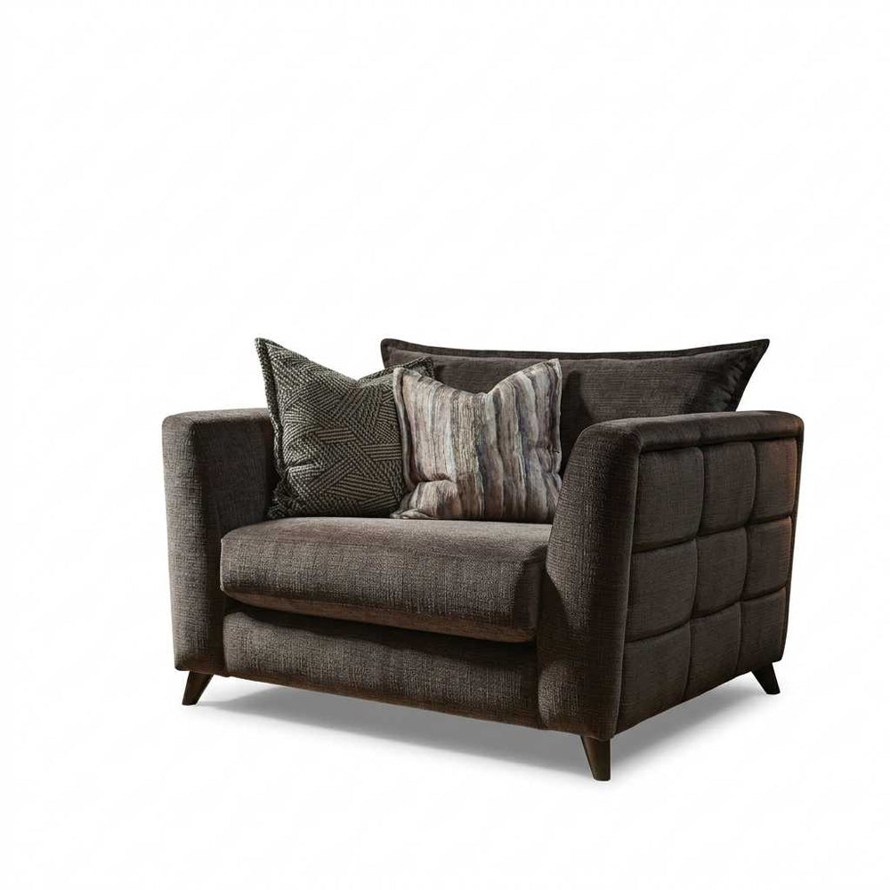 Brown sofa with patterned cushions on a white background