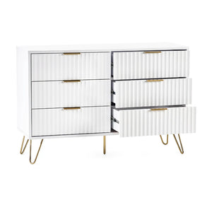 White dresser with gold accents on a white background