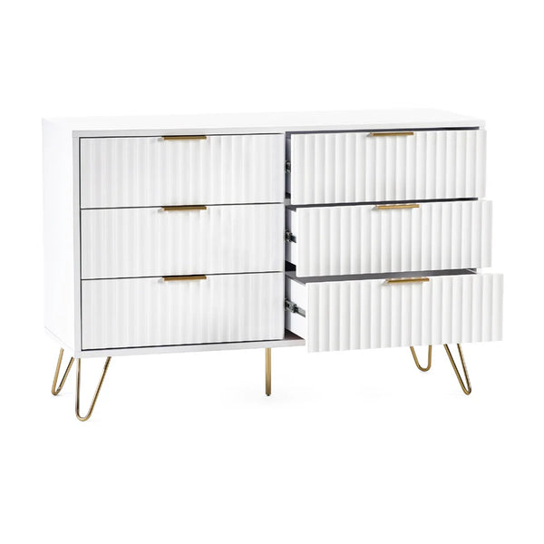 White dresser with gold accents on a white background
